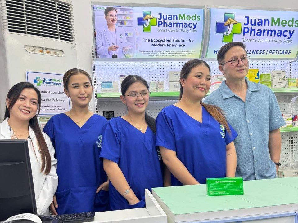 JuanMeds Pharmacy team at the counter of a branch