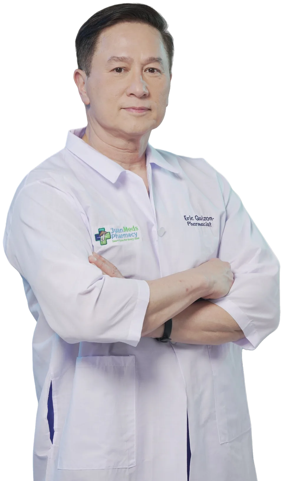 Eric Quizon wearing a JuanMeds Pharmacy coat, arms crossed