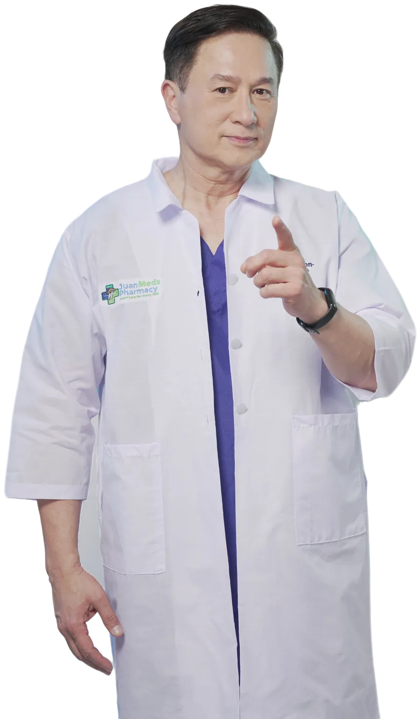 Eric Quizon in a JuanMeds Pharmacy coat, pointing toward the viewer